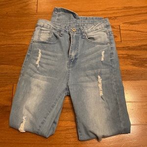 size xs lightwash jeans with slight rips!